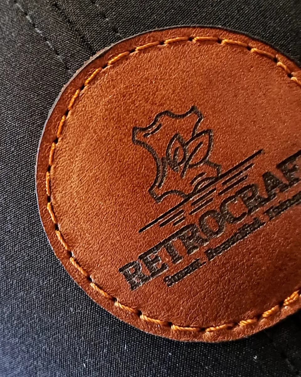 Close-up of an engraved, stitched RetroCraft leather patch