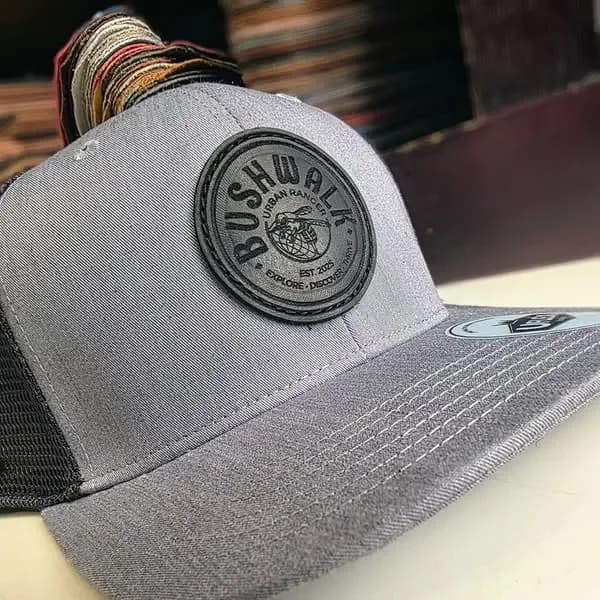 Bushwalk grey trucker cap with a round leather patch